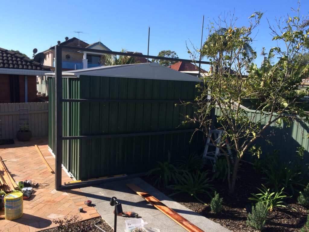Merbau screen at the framing stage, hiding a garden shed, Randwick
