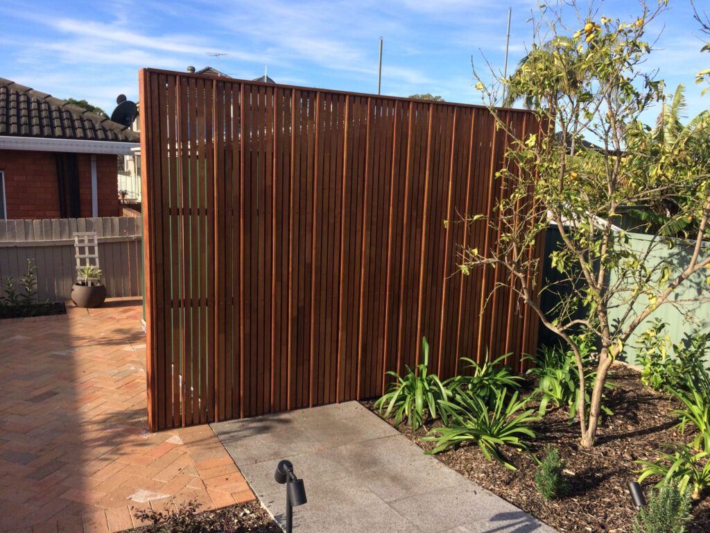 Merbau screen hiding a garden shed, Randwick