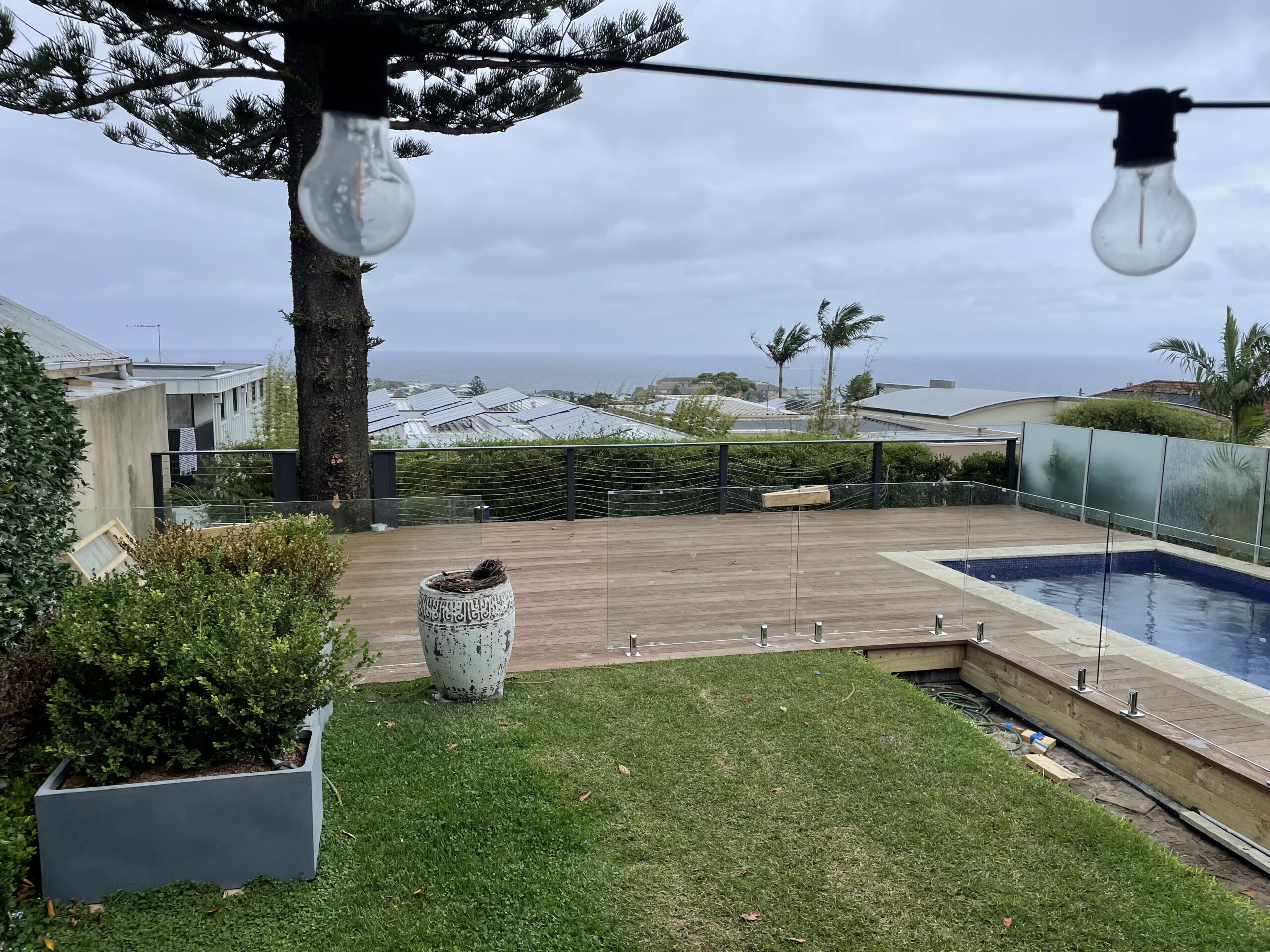 Pool fence and balustrade going in, Clovelly pool deck — The Decksmith