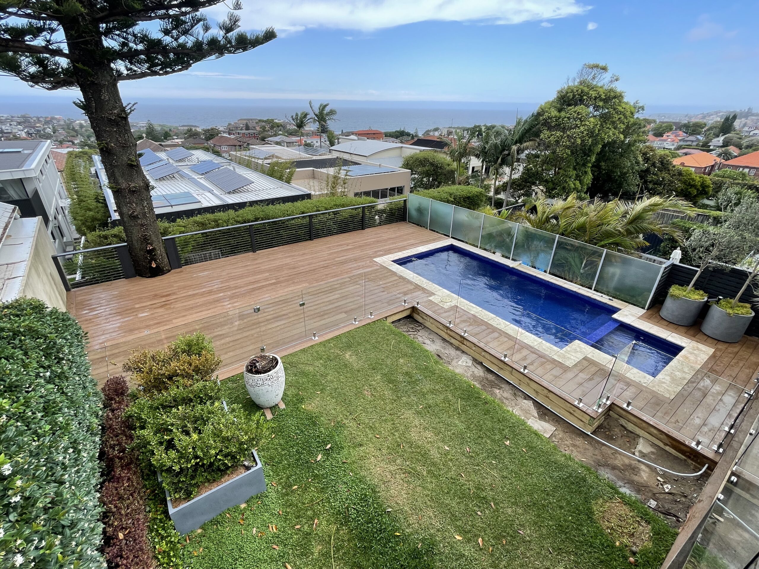 Final clean of the completed deck, Clovelly pool deck — The Decksmith