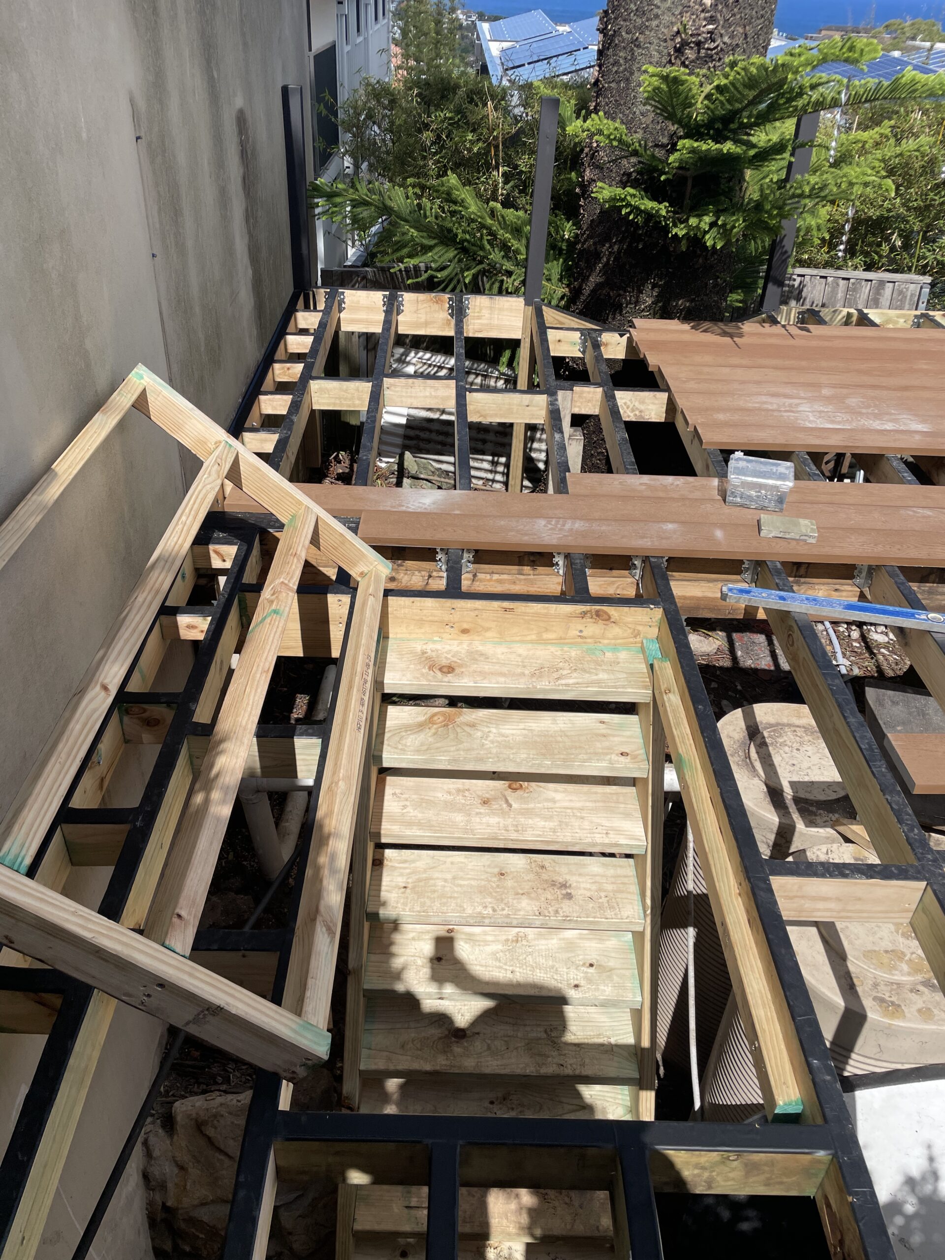 Concealed trap door open in the decking, Clovelly pool deck — The Decksmith