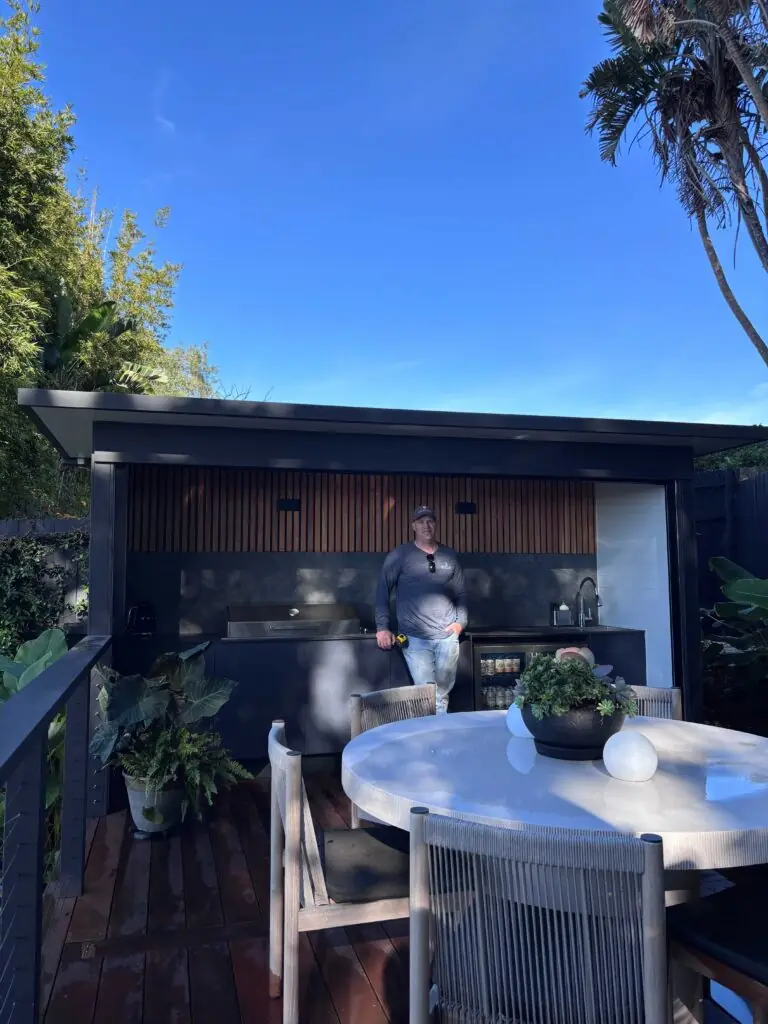 Greg, founder of The Decksmith, in a finished outdoor entertaining area in Coogee