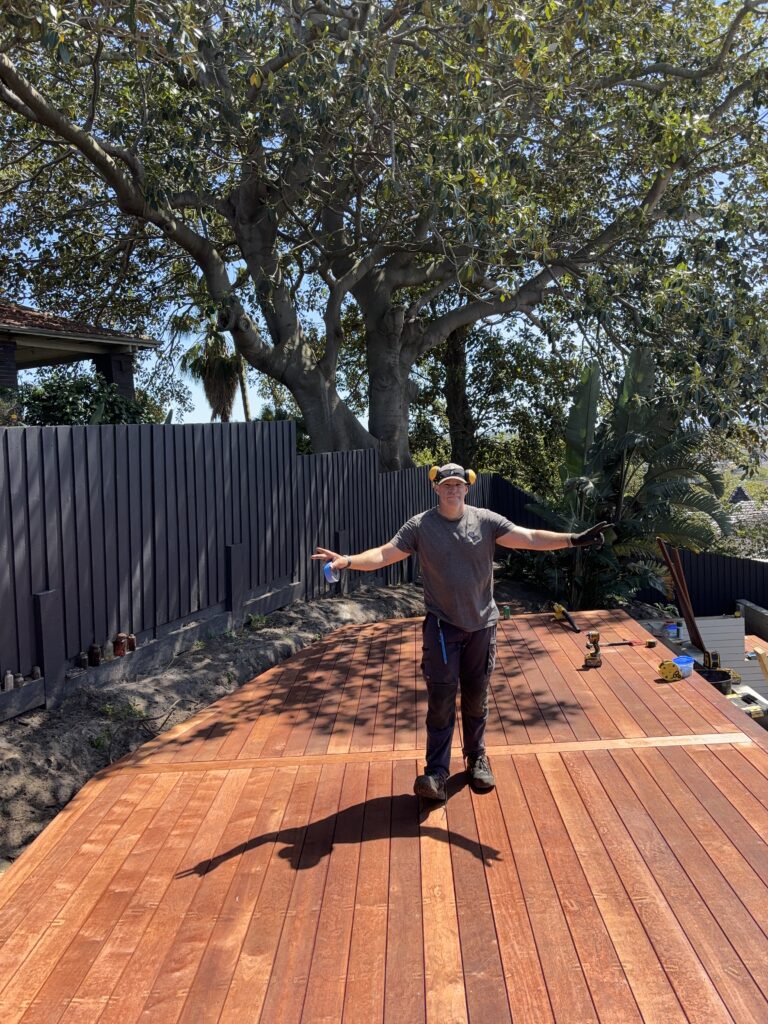 Completed luxury multi-stage deck transformation showing Pacific Ocean views from Coogee coastal retreat by The Decksmith