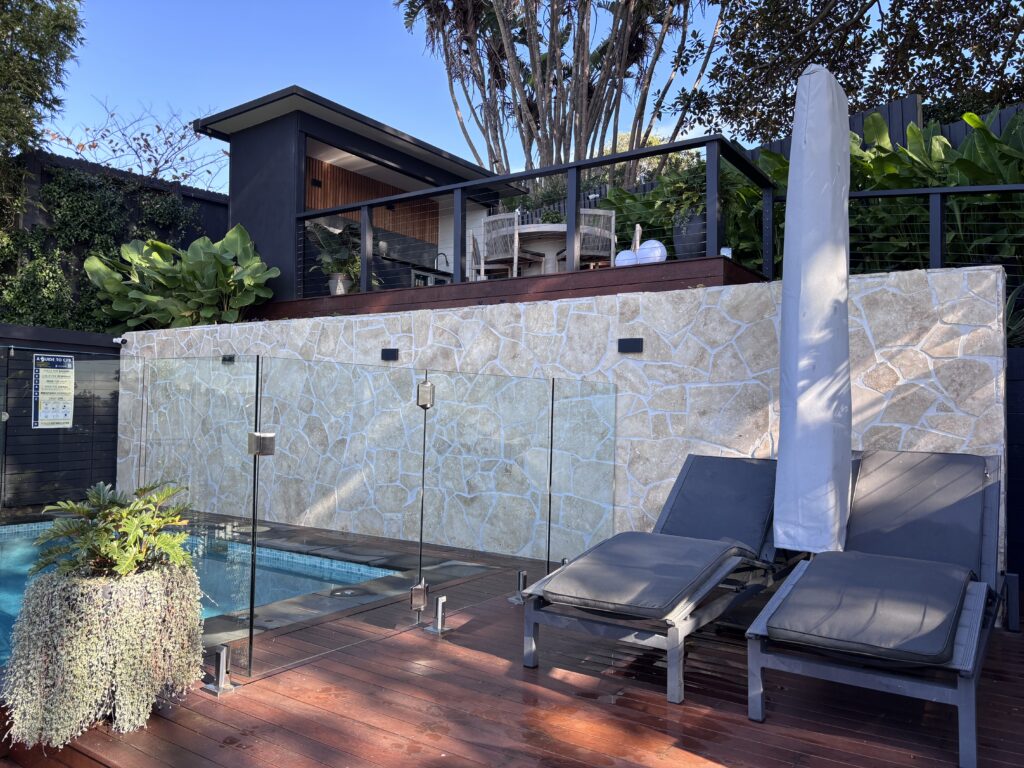 Aerial view of a multi-level Merbau pool deck and outdoor living area, Coogee