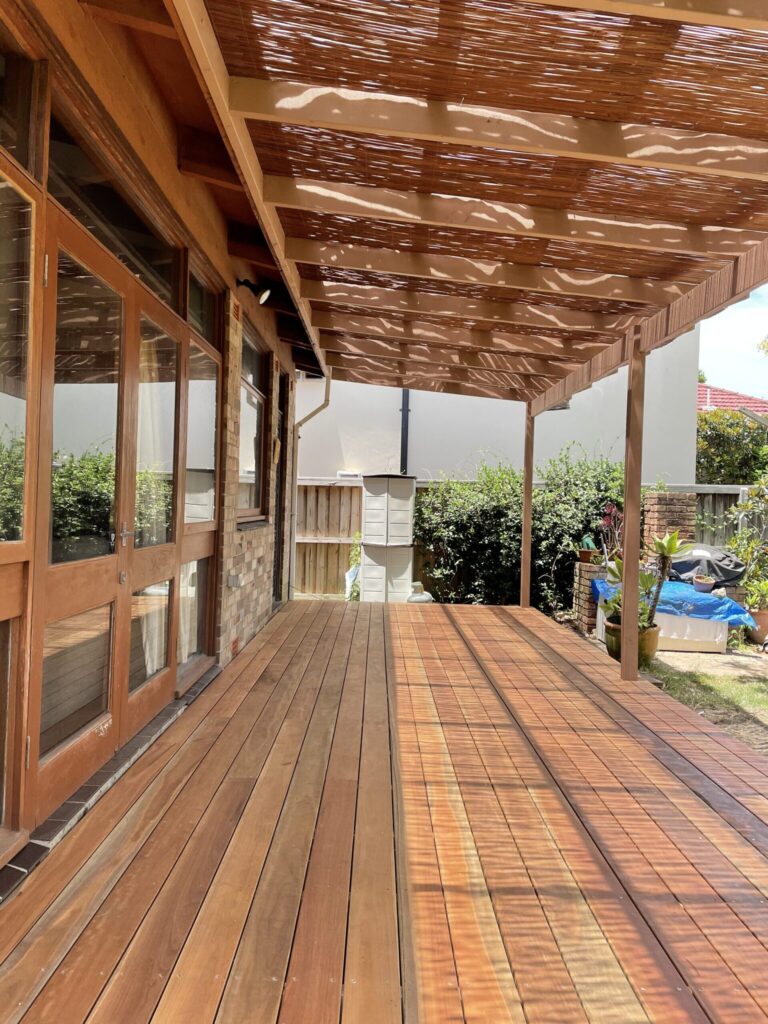 Spotted Gum timber deck beneath a matching slatted timber pergola