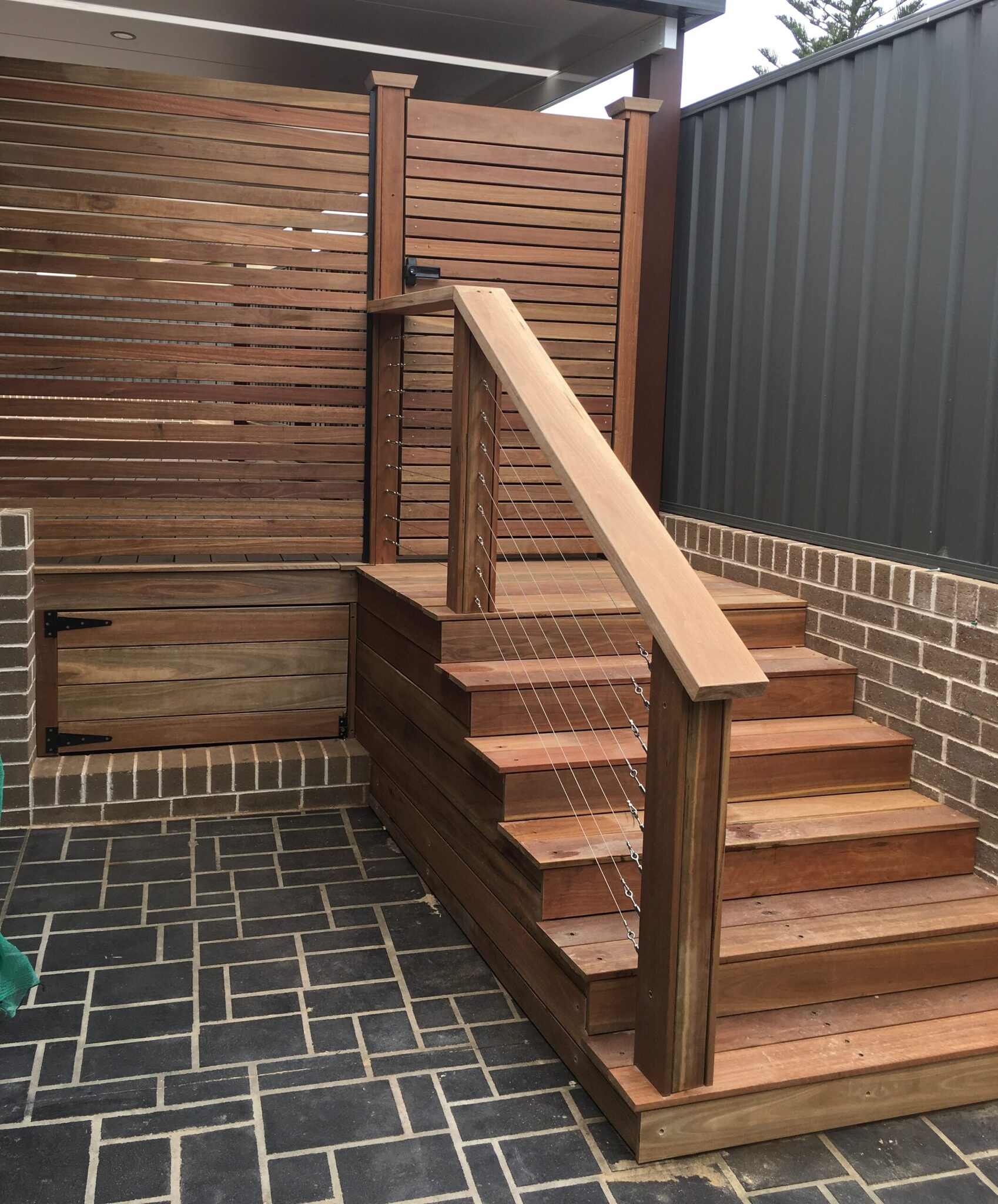Luxury Spotted Gum entertaining deck with stainless cable security gate in Little Bay