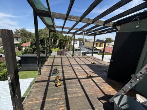 Pergola roof sheets being removed from Mascot rooftop