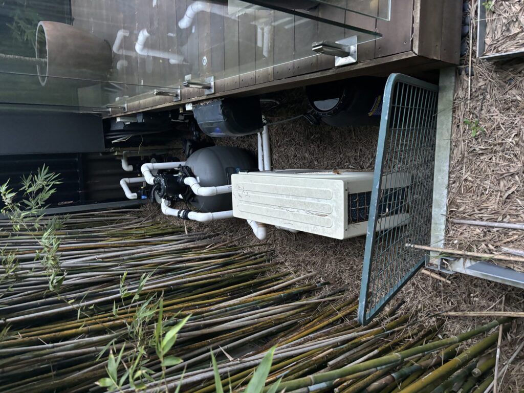 Exposed pool equipment eyesore before stealth hatches in Kingsford