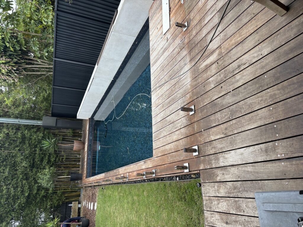 Glass fence remove and safely stacked for re-installation to new deck in Kingsford