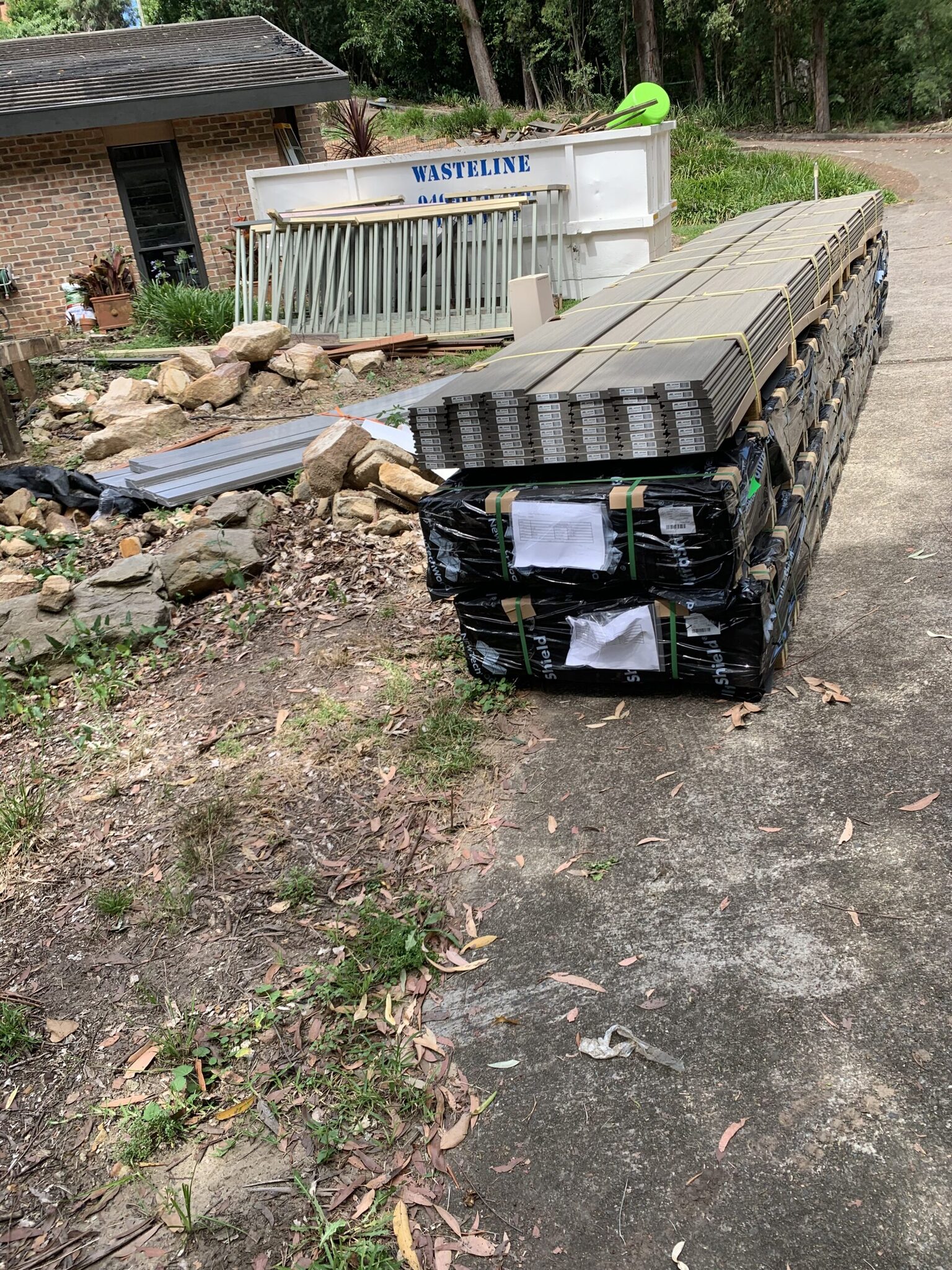 Delivery day — NewTechWood Silver Grey on site.