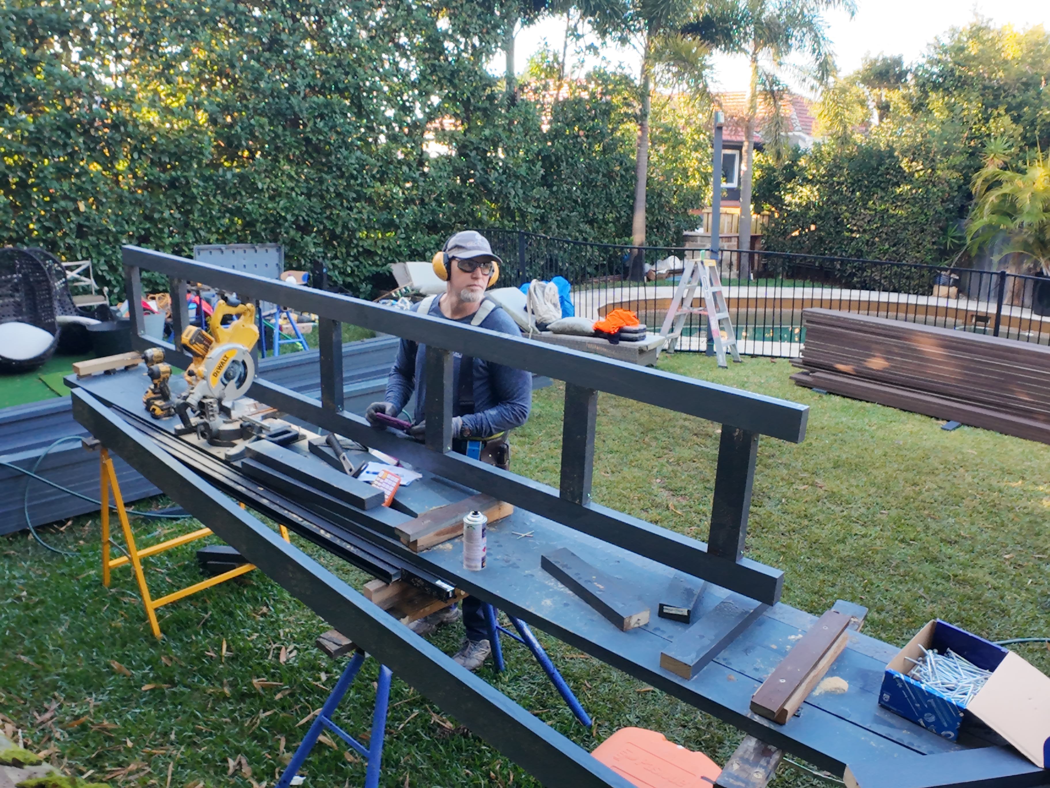 Greg cutting and fitting balustrade timber on site, Vaucluse