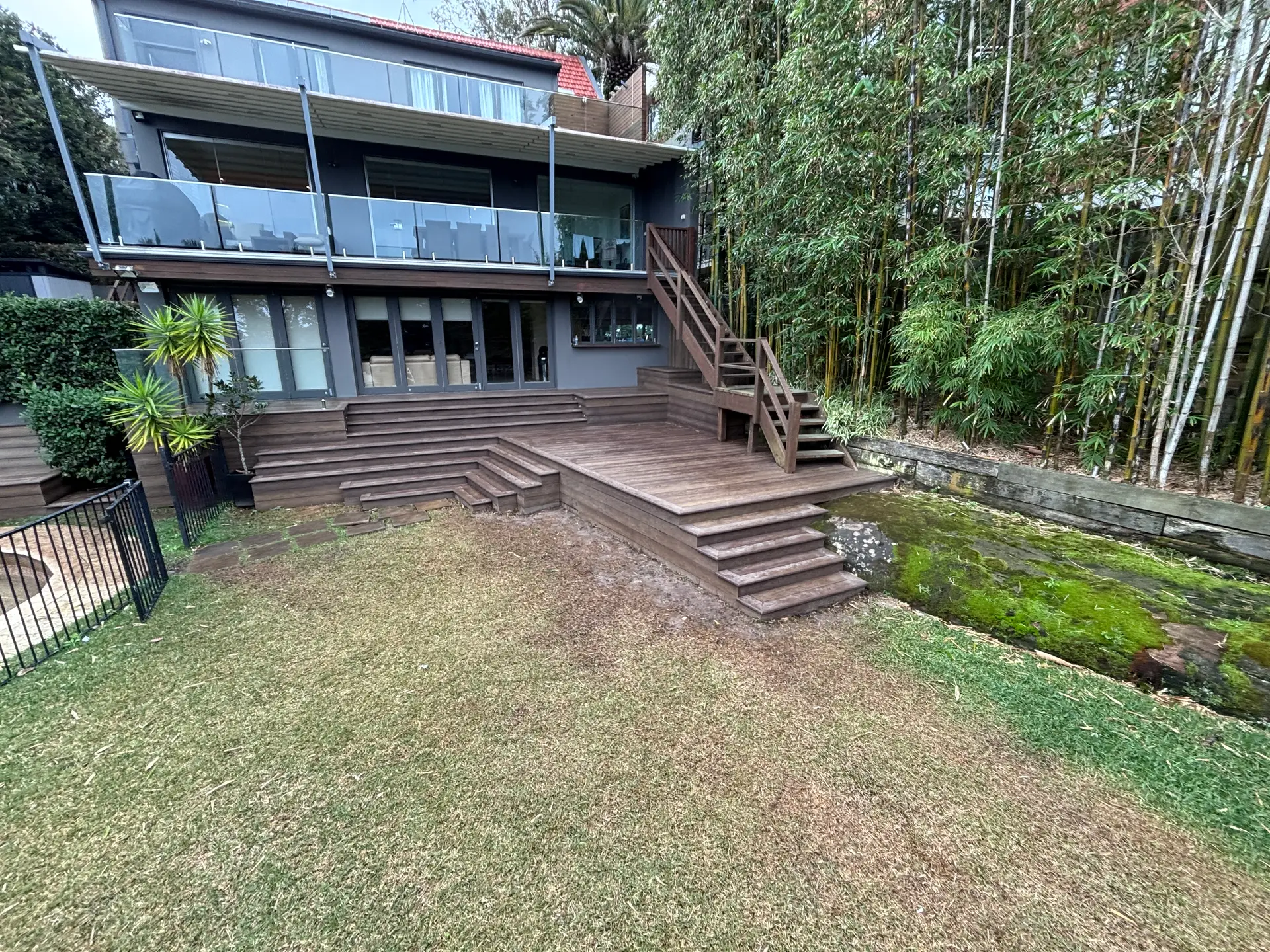 Millboard deck, steps and lawn at the rear of a Vaucluse home