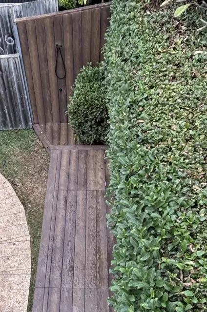 Rebuilt outdoor shower wall in Millboard Antique Oak, Vaucluse