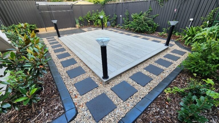 Millboard Smoked Oak deck with paver border at Maroubra