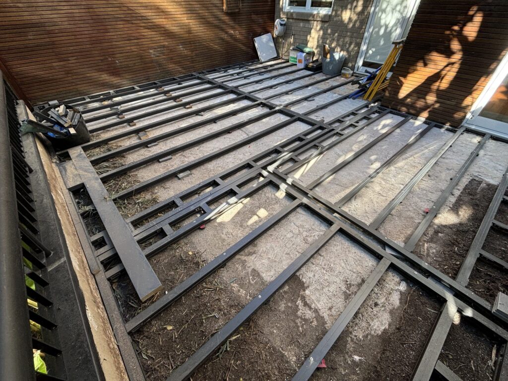 Completed ClickDeck aluminium subframe across courtyard slab before decking, Neutral Bay