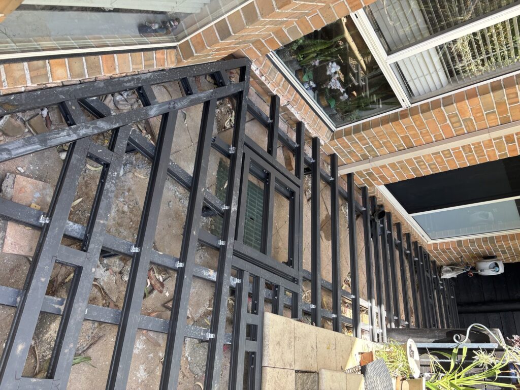 ClickDeck aluminium framing with picture frame perimeter and hinged access panel, Matraville