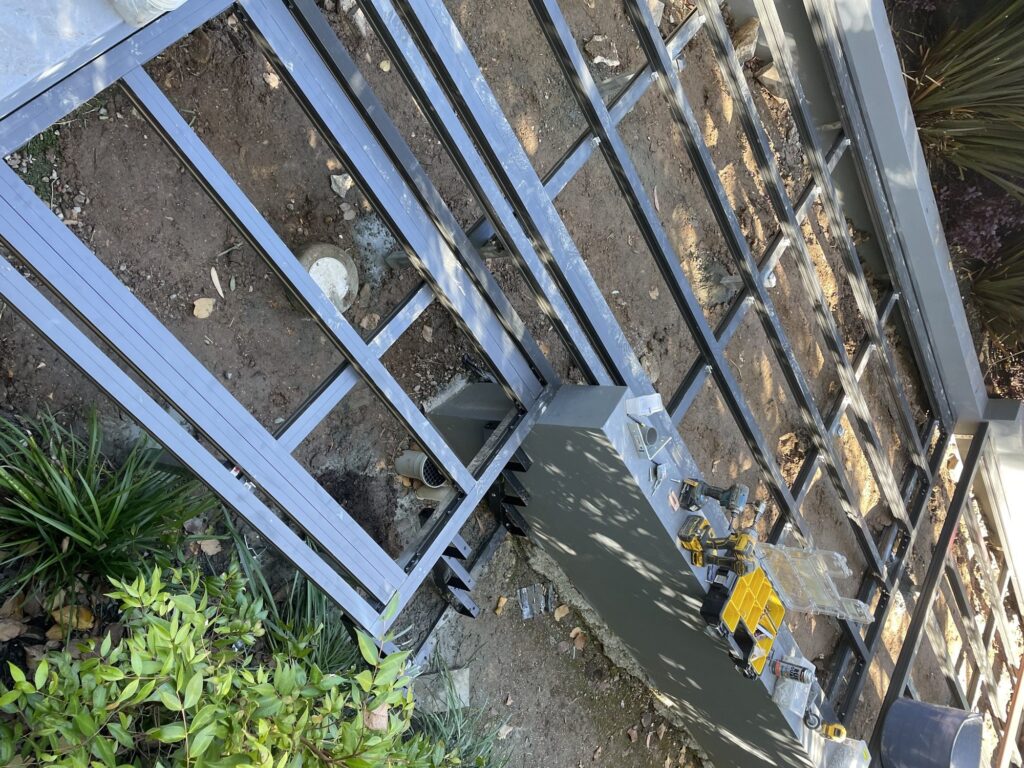 Stepped ClickDeck aluminium framing set out to match existing retaining walls, Pymble