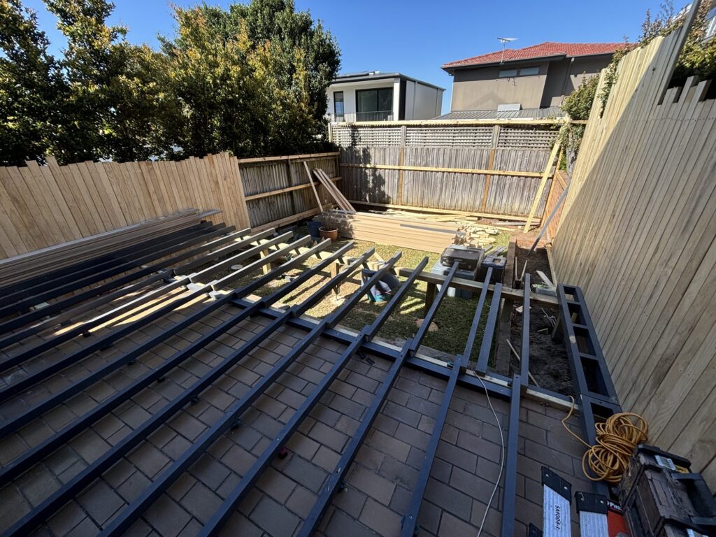 Millboard Lowdeck H4 treated deck framing installed over the existing paving, Dover Heights