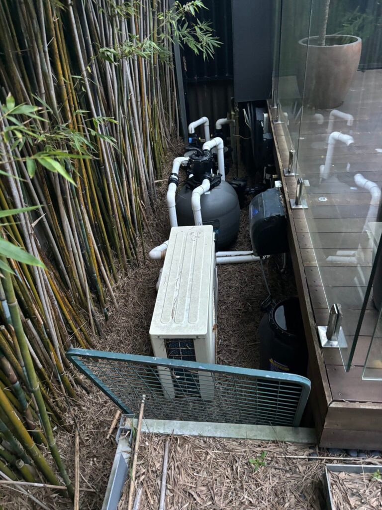 Exposed pool equipment eyesore before stealth hatches in Kingsford