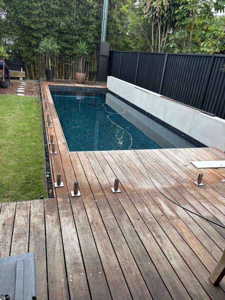 Glass fence remove and safely stacked for re-installation to new deck in Kingsford