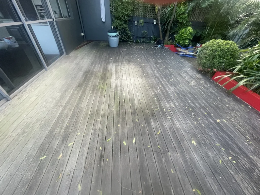The old timber deck in Maroubra before replacement, boards weathered and grey