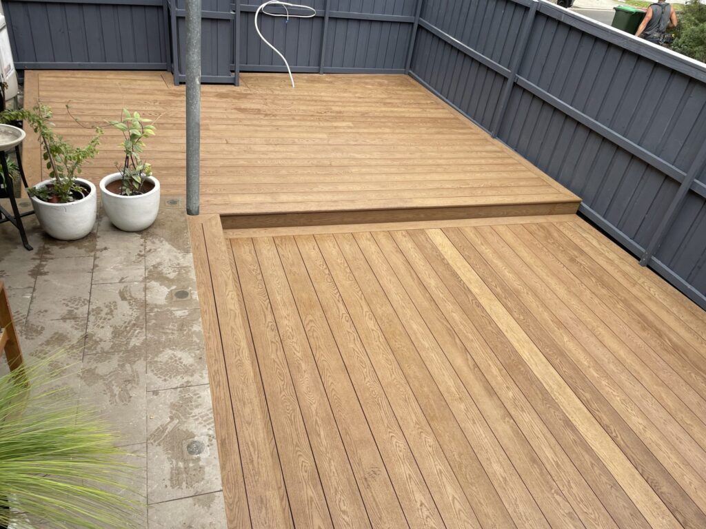 Picture-framed Millboard split-level deck in a Matraville courtyard