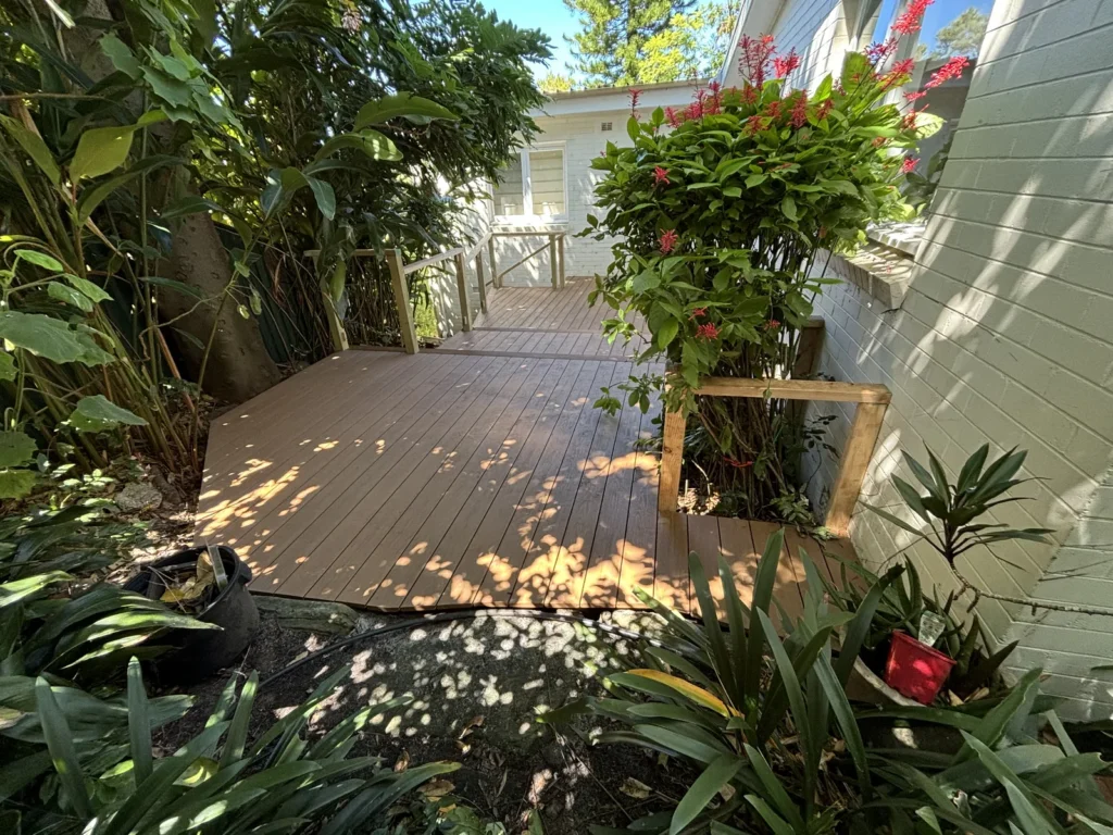 Deck boards trimmed to the rock line and painted in colour-matched external Dulux, Neutral Bay