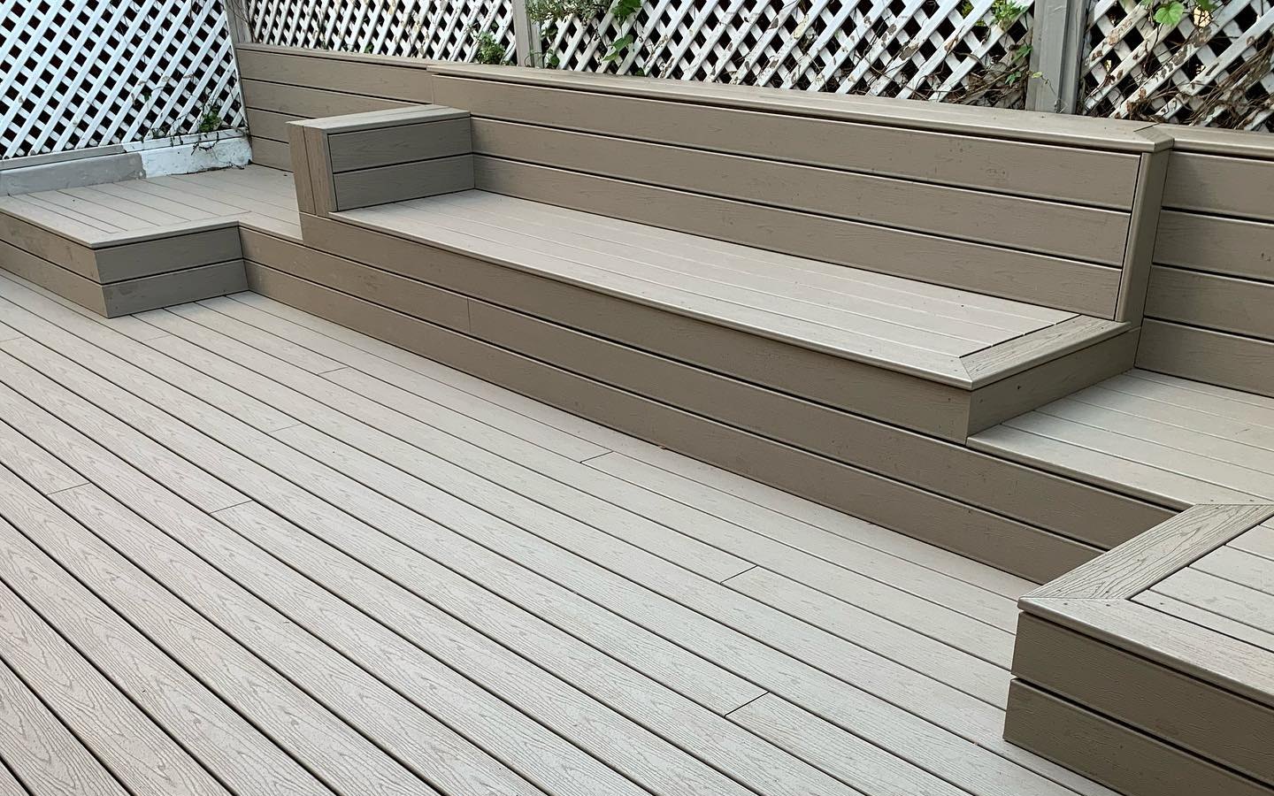 Trex decking in Gravel Path used to create a courtyard deck and seating area with daybeds and backrest