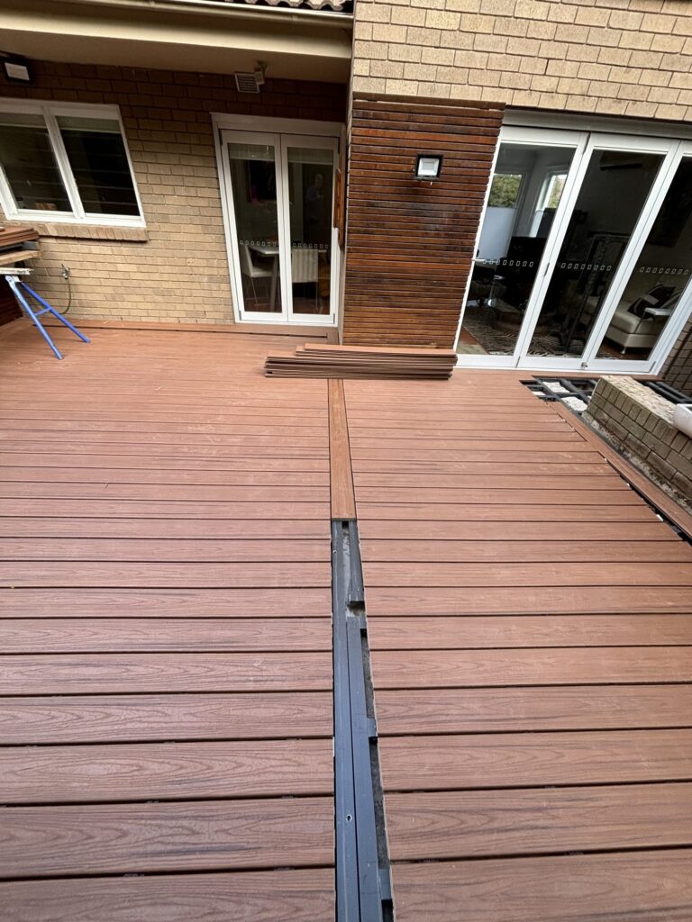 Trex Transcend Tiki Torch breaker board being installed on ClickDeck aluminium frame, Neutral Bay