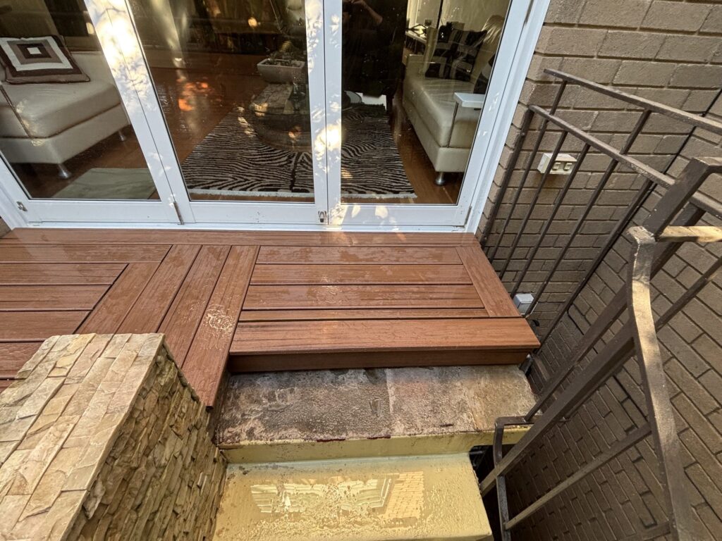 Decked step at garage stairs matching raised courtyard deck height, Neutral Bay