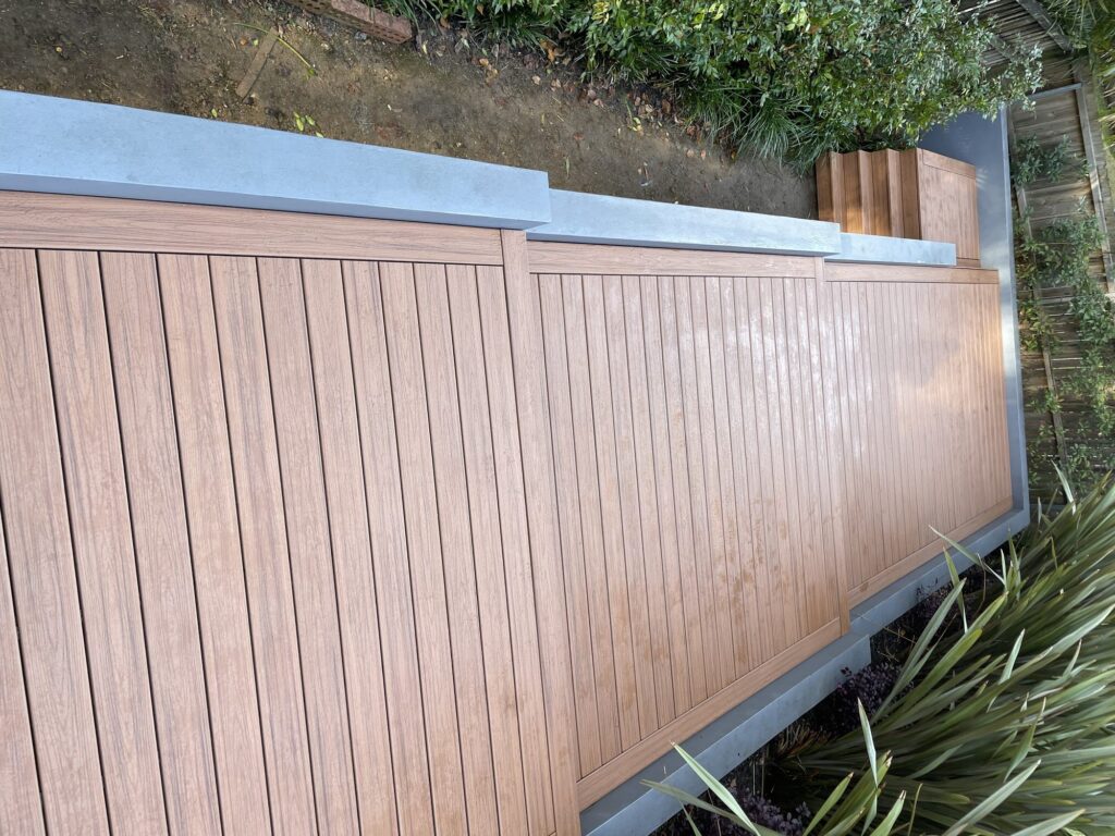 Finished stepped Trex Transcend Tiki Torch deck with steel-stringer stairs to garden, Pymble